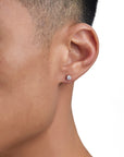 Model wearing white gold moissanite earrings by Iceman Society