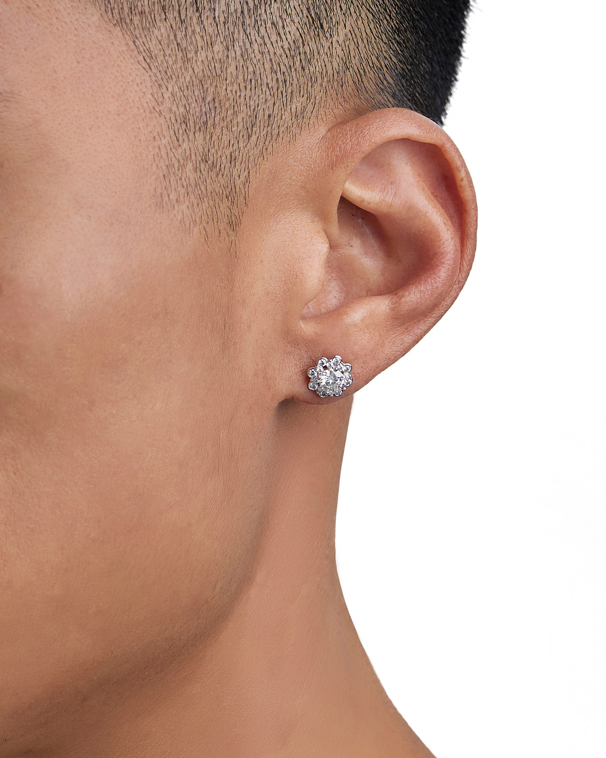Model wearing white gold moissanite earrings by Iceman Society