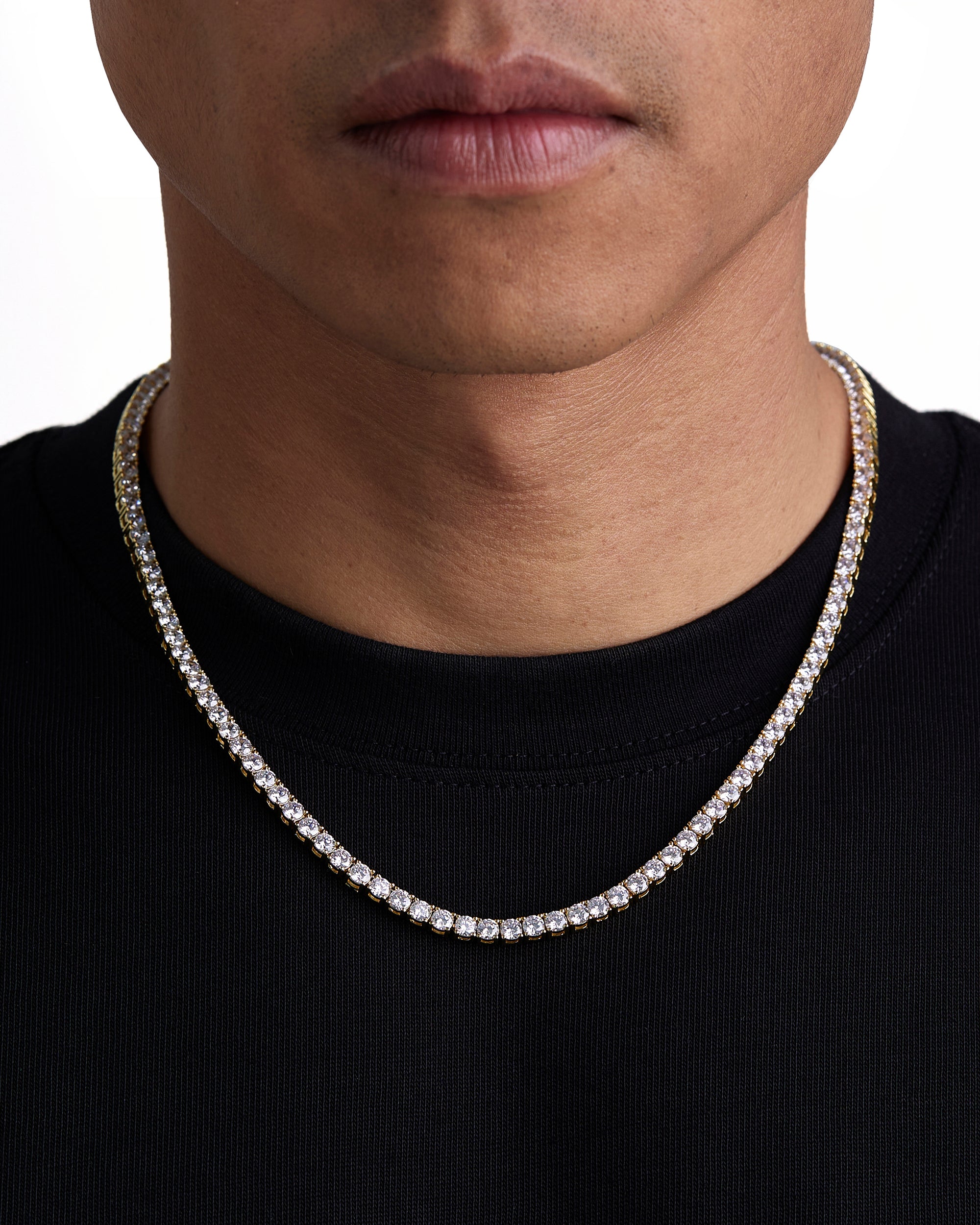 Model wearing 4mm 18k gold tennis necklace by Iceman Society, front view