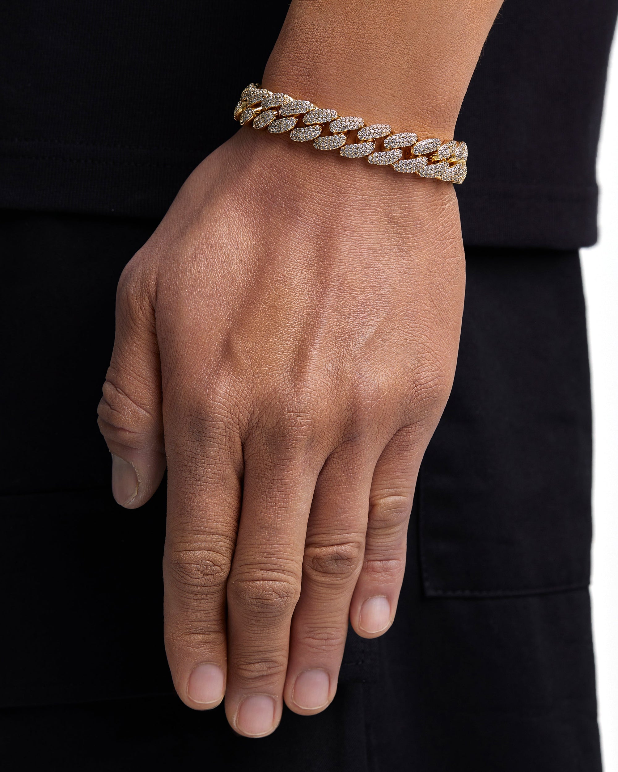 Model wearing 12mm 18K gold iceman cuban chain set by Iceman Society, side view