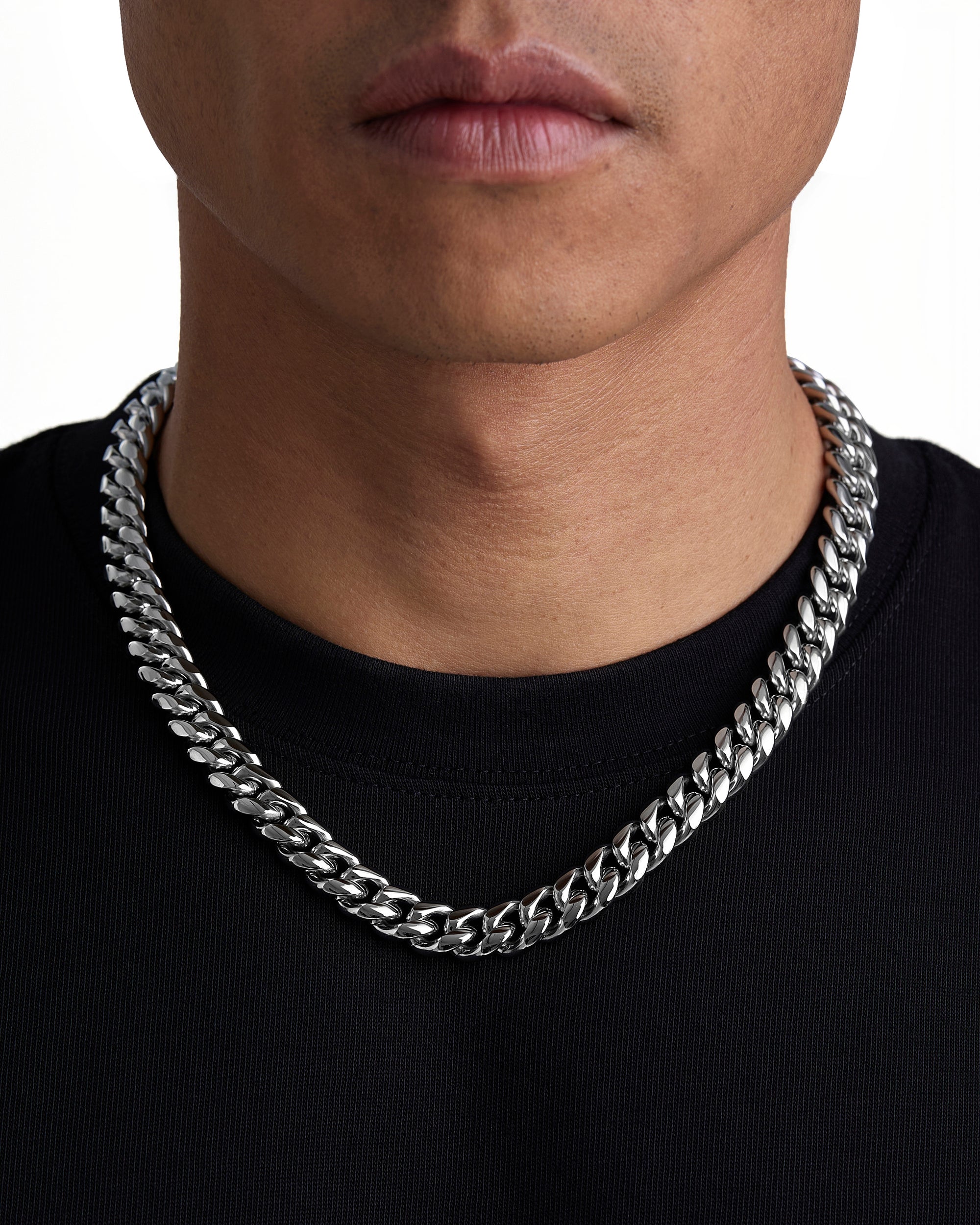 Model wearing 12mm white gold plain cuban necklace by Iceman Society