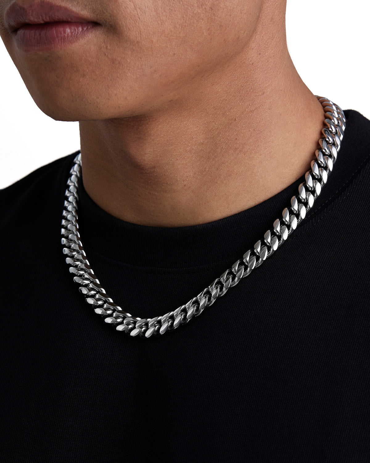Model wearing 12mm white gold plain cuban necklace by Iceman Society, side view