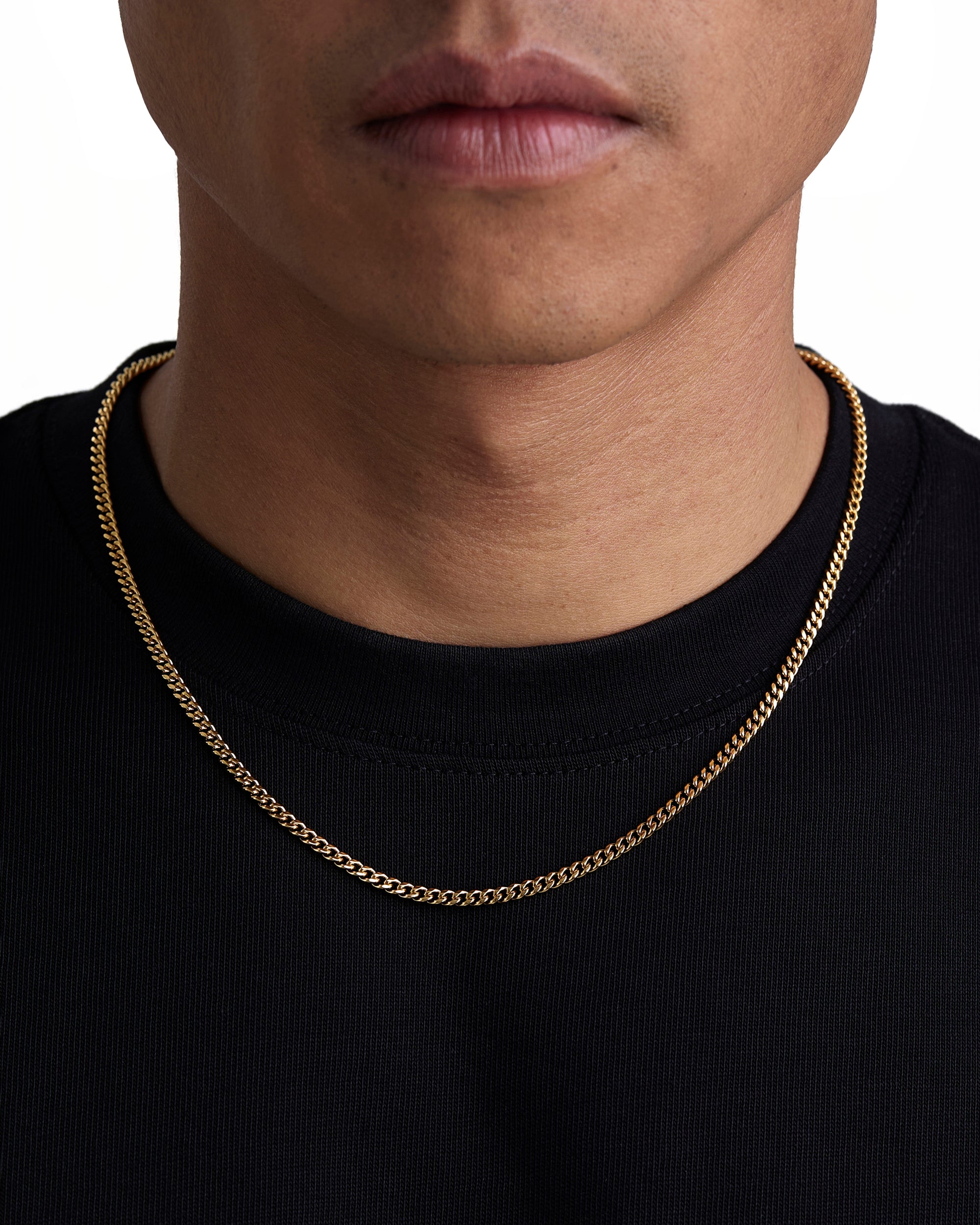 Model wearing 3mm 18k gold plain cuban necklace by Iceman Society