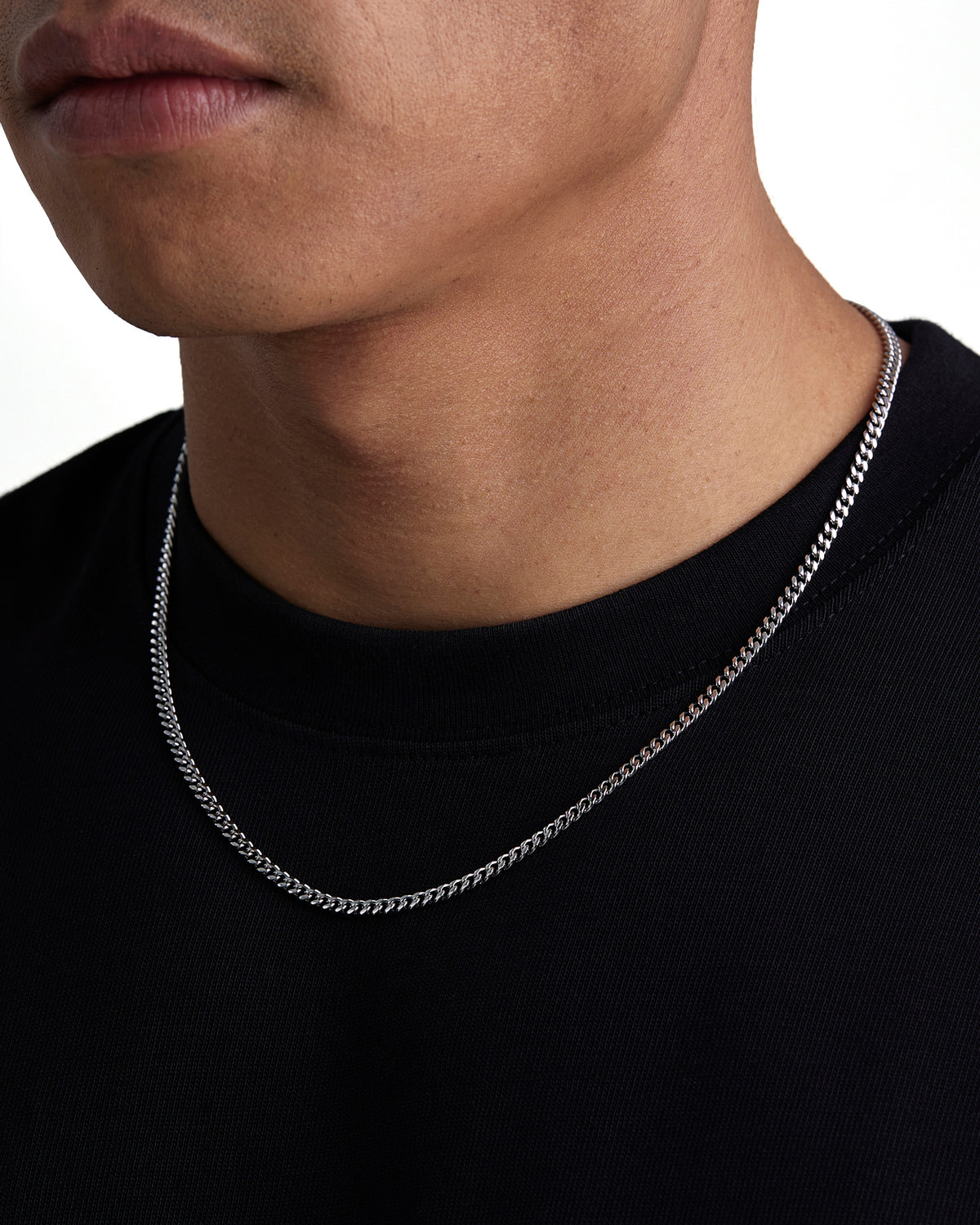 Model wearing 3mm white gold plain cuban necklace by Iceman Society, side view