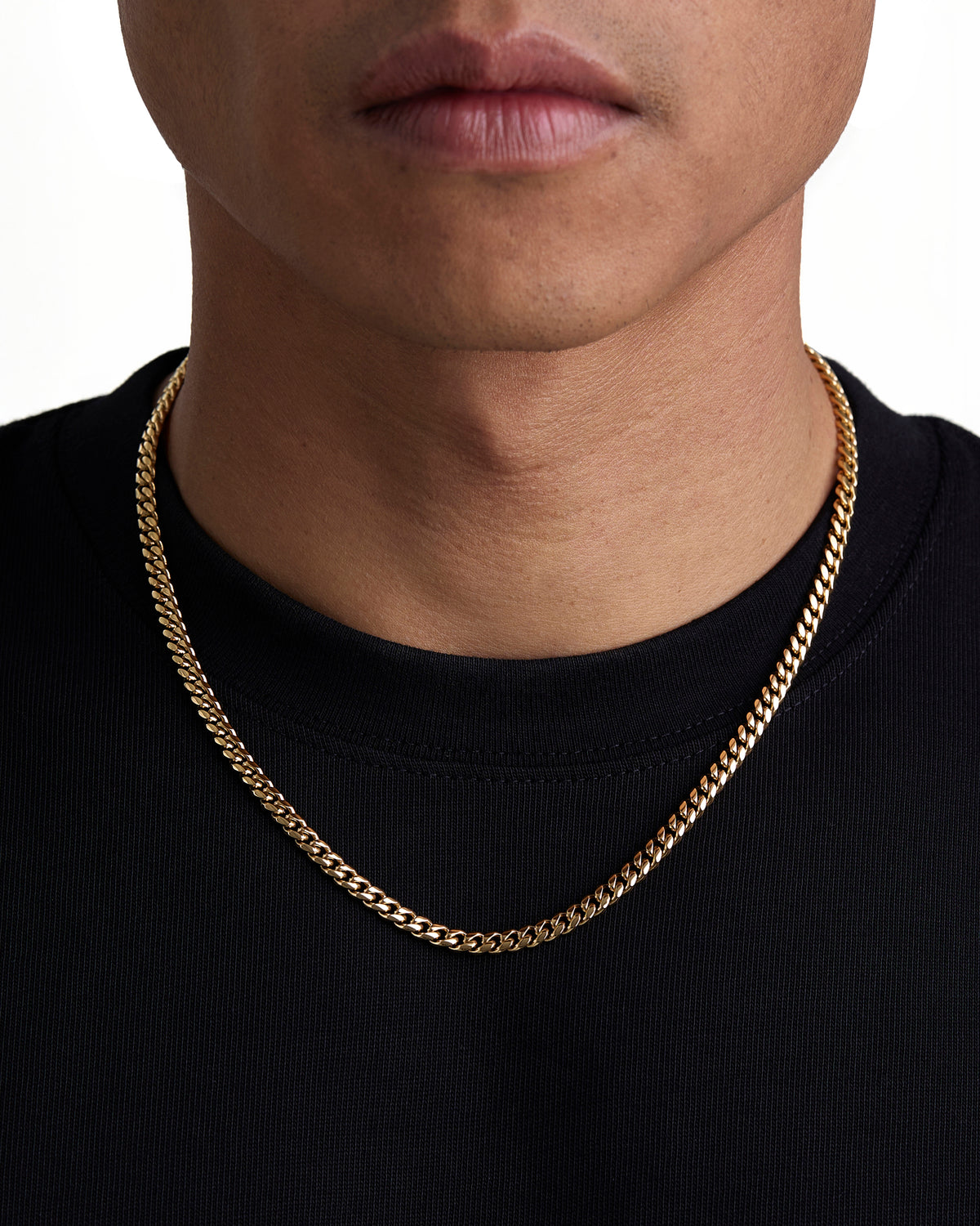 Model wearing 5mm 18k gold plain cuban necklace by Iceman Society