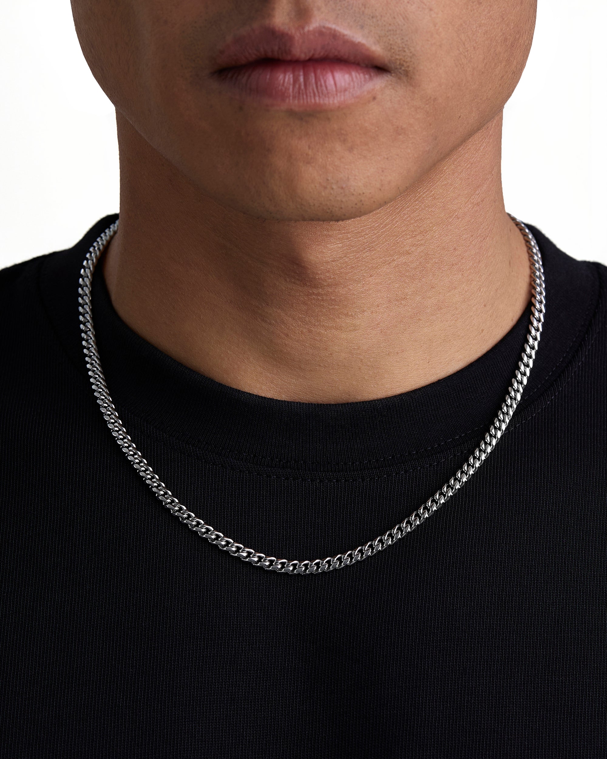 Model wearing 5mm white gold plain cuban necklace by Iceman Society