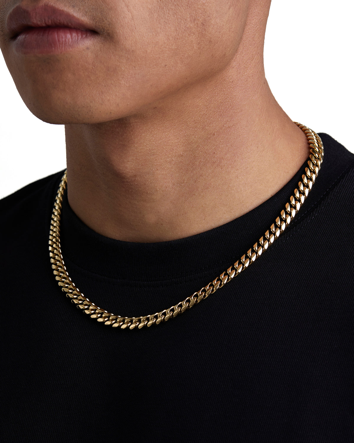 Model wearing 8mm 18k gold plain cuban necklace by Iceman Society, side view